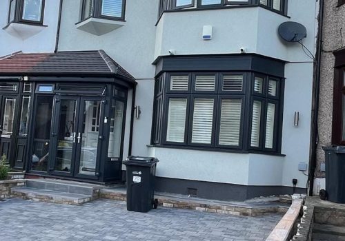 Silicone thin-coat render on a renovated semi-detached home in Greater London.