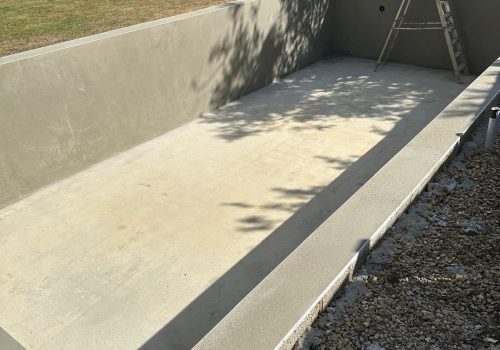 Traditional cement render application inside a newly constructed swimming pool in the London vicinity.